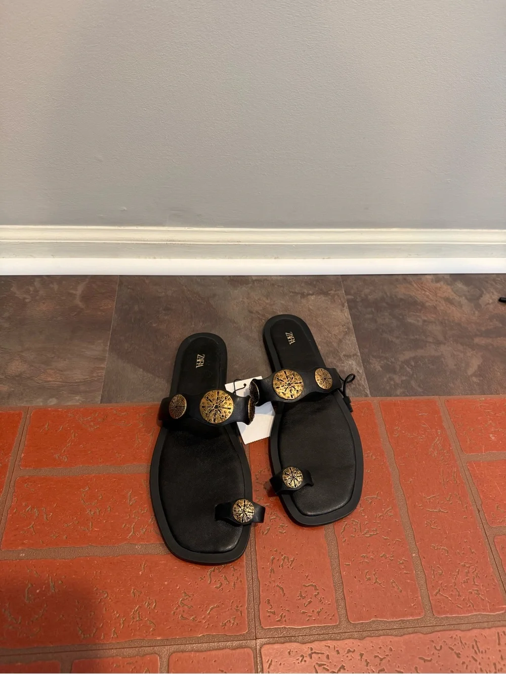Zara Black Leather Toe-Loop Sandals with Brass Medallions - Women